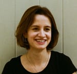 Picture of Celestine, a white woman with short dark hair and a wide smile.