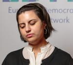 Profile picture of Esma, a woman with white skin and short dark hair, looking thoughtful and with eyes mostly closed.